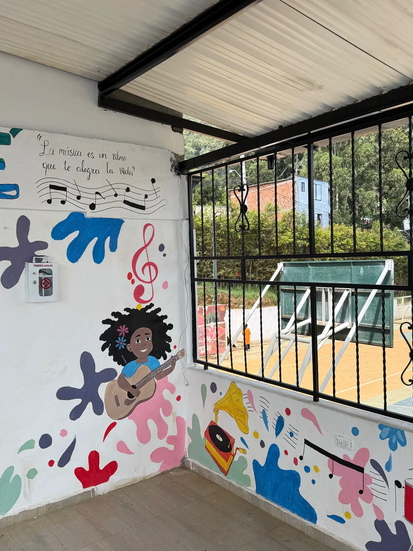 Children of Medellín Foundation: the painted music mural inside the community building
